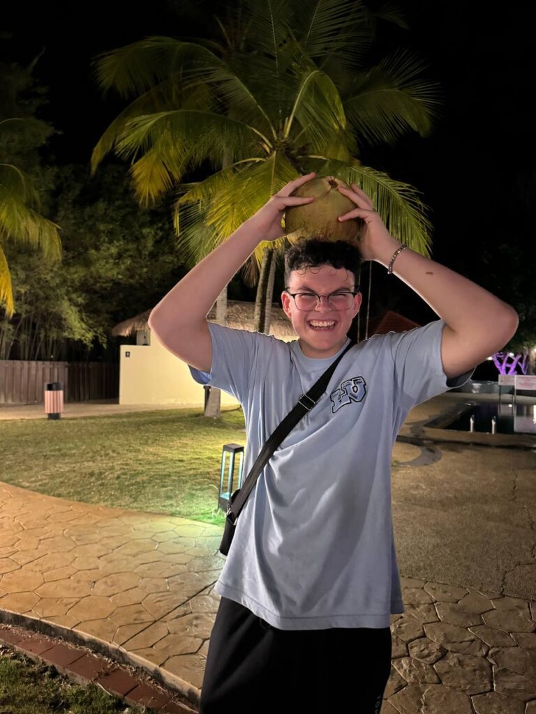 a boy take picture with a smile. -International Camps in Singapore